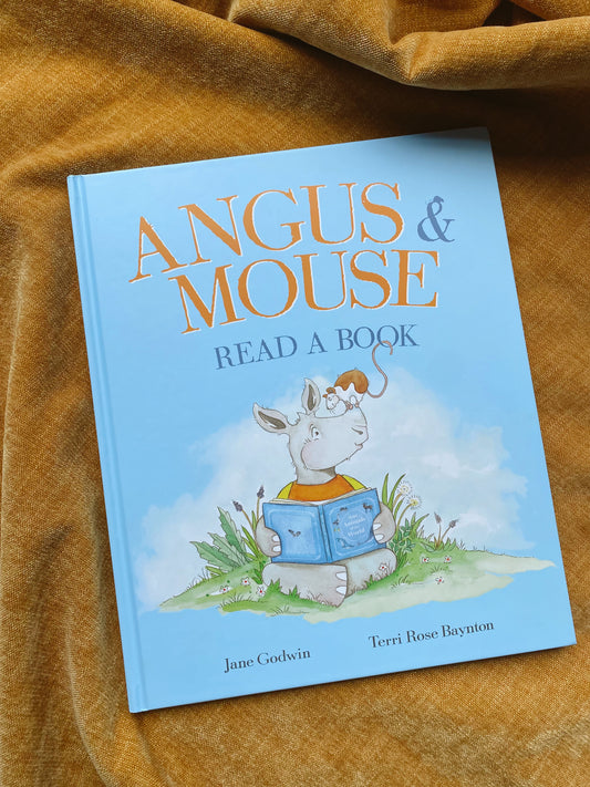 Angus and Mouse read a book